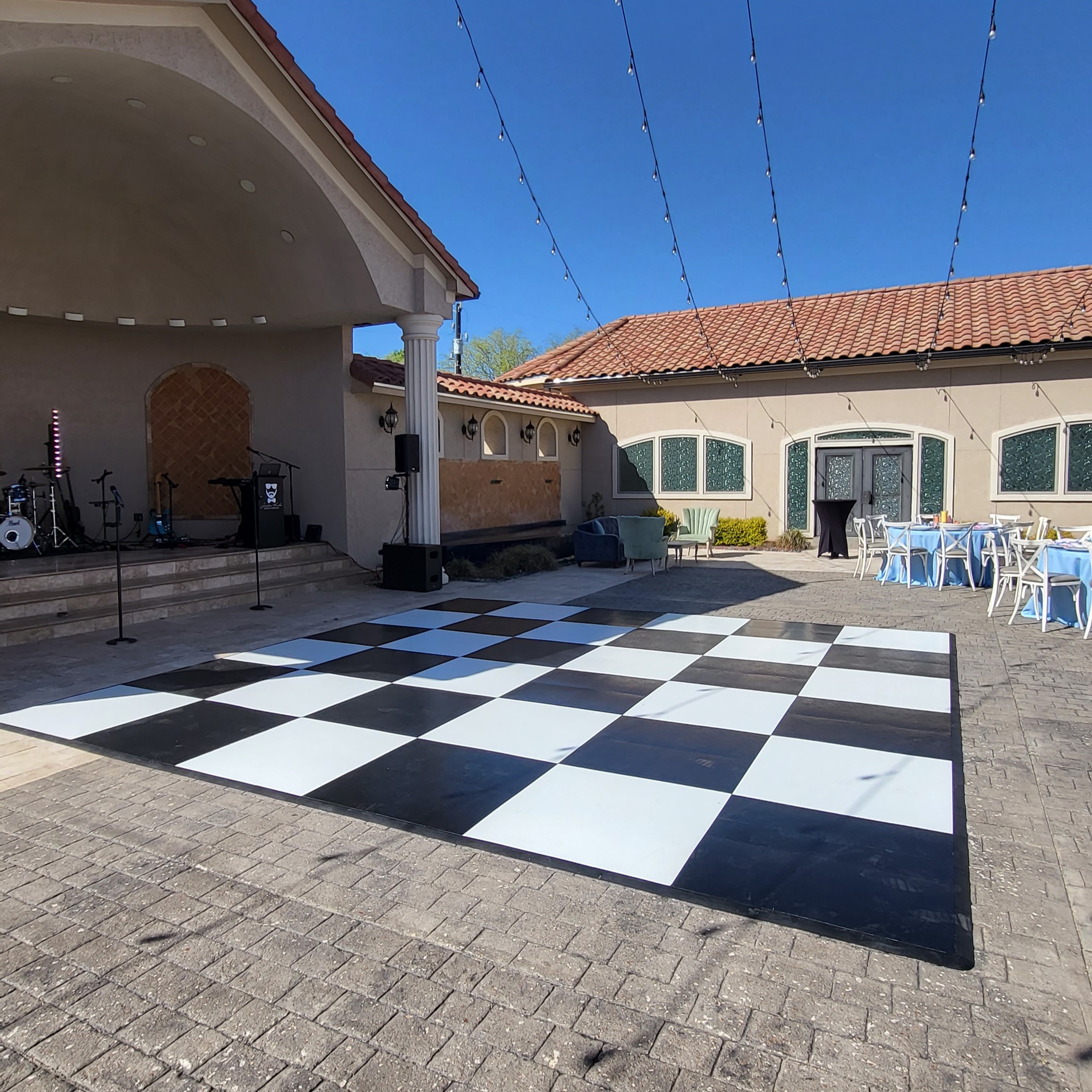 Outdoor Checkered Black and White Dancefloor on Brick